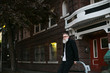 © Rob and Julia Campbell/Stocksy - Fashionable, thoughtful bearded man hanging out in downtown Seat