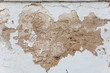 © kkgas/Stocksy - decaying plaster on white wall