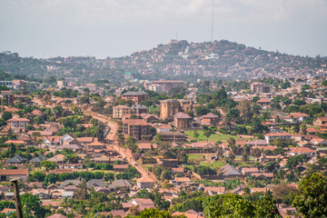 Wall Mural - dirt road winds through village in kampala uganda africa