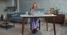 Comfortable Work From Home On Lockdown. Young Cheerful Business Woman In Pajamas Pants Using Laptop Video Conference App
