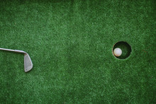 The Stick Lies On The Field Next To The Hole. Stick Lying Near Golf Ball. Green Golf Sport. The Stick Lies To The Hole.