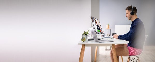 Businessman Attending Video Conference On Computer