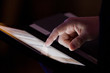 Closeup of fingers browsing tablet, iPad