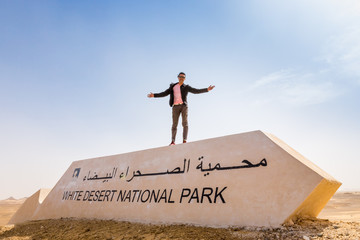 Wall Mural - Man with open arms in the White Desert, Egypt.