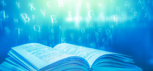 Poster - The concept of education by planting a tree of knowledge in the opening of an old book in the library and the magical magic of light that flies to the destination of success. Beautiful background