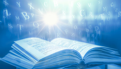 Poster - Stack of books in the library and blur bookshelf background	
