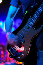 A Closeup Of A Guitarist Strumming An Electric Guitar On Stage During A Rock Music Performance At A Venue On 6th Street In Austin, Texas. 