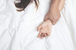 © methaphum - Feeling on hand of passion couple having sex. two Lover man and woman under blanket white sheets on the bed with lust and making love. concept having sexual romantic moments or Sexual harassment.