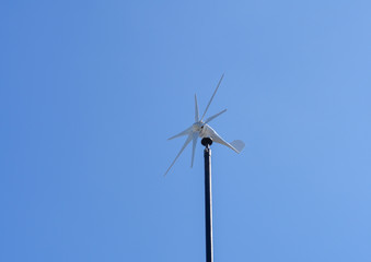 Wind turbine or windmill on the pole to generate electricity