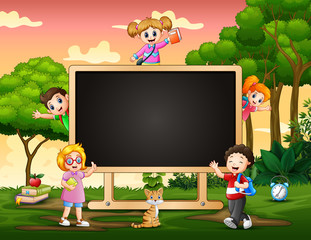 Wall Mural - A blackboard with happy children