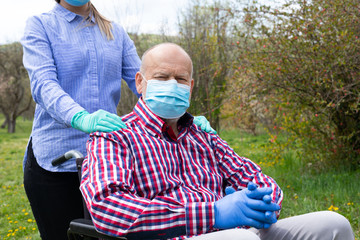 Sticker - Assisted elderly man sitting in wheelchair