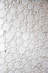 Glass tile shaped like round droplets