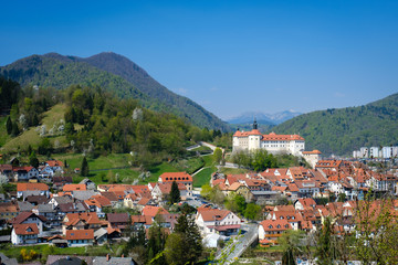 Skofja Loka old town with Lubnik hill from Hribec in spring