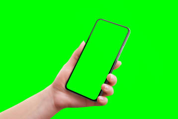 Leinwandbilder - Phone mockup isolated in chroma key green. Soft retouched woman hand holds the phone. Close-up
