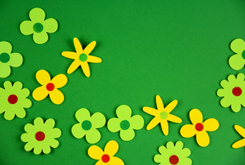 Abstract flowers on a green background stock images. Abstract spring meadow stock images. Beautiful blooming flower border stock images. Floral frame images. Floral green spring background