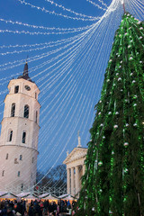 Wall Mural - Christmas tree and Xmas bazaar Vilnius Advent Lithuania evening