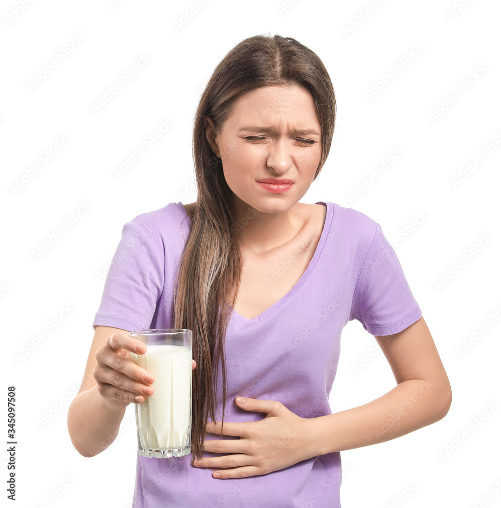 Young woman with milk allergy on white background