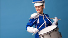 Drummer In A Blue Uniform Drums On A Drum, Show Program And Celebration.