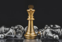 Winner. Shot Of Golden King Surrounded With Silver Chess Pieces On Chess Board Game Competition With Dark Background, Chess Battle, Victory, Success, Team Leader, Teamwork, Business Strategy Concept