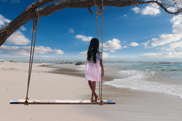 young woman walking on the beach