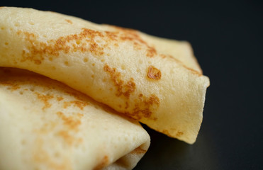 Wall Mural - Cheesy, beautiful, delicate pancake closeup. Soft focus and gentle bokeh.