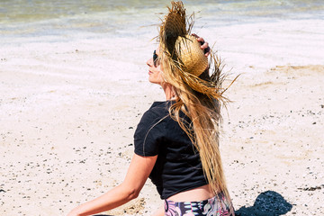 Wall Mural - Beautiful long blonde hair young caucasian woman enjoy the tropical beach and summer holiday vacation activity - tourism and tourist concept and wanderlust travel people after lockdown covid-19