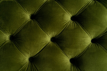 part of green velvet sofa top view