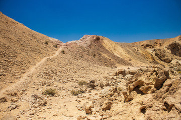 desert waste and dry ground hills rocky sand stone global warming environment in the middle of nothing place