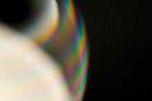 Psychedelic Abstract Planet From Soap Bubble, Light Refraction On A Soap Bubble, Macro Close Up In Soap Bubble. Rainbow Colors On A Black Background. Model Of Space Or Planets Universe Cosmic Galaxy.