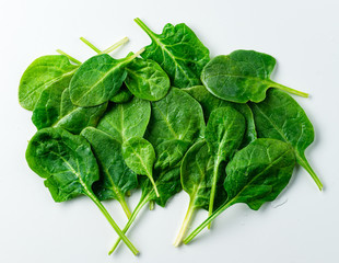 Poster - Creative layout made of spinach. Flat lay. Food concept. Spinach on white background