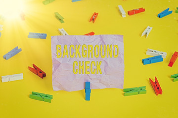 Word writing text Background Check. Business photo showcasing way to discover issues that could affect your business Colored clothespin papers empty reminder yellow floor background office