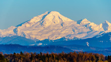 Sunset Over Mount Baker, A Dormant Volcano In Washington State. Viewed Glen Valley Near Abbotsford British Columbia, Canada Under Clear Blue Sky On A Nice Winter Day