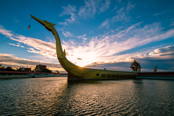 Royal Barge Suphannahong sculptured in the river with twilight sky of sunset, Kanchanaburi province