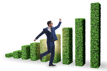 Businessman in green ecology growth concept