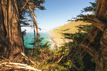 Big Sur At Ragged Point, California Coastline.  Scenic View Of Cliffs, Ocean, And Cypress Trees