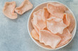 © la_vanda - Delicious crispy chips made of starch, flour and shrimp. Bowl of Krupuk (prawn crackers). Traditional Asian snack. A dish of Indonesian, Malaysian, Chinese, Korean, Japanese cuisine. Selective focus