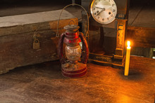 Vintage Oil Lamp ,old Wooden Box ,alarm Clock And Candlelight On Old Wooden Touch-up In Still Life Concept