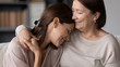 © fizkes - Smiling mature mother hugging adult daughter close up, expressing love and care, family enjoying tender moment, happy young woman and middle aged mum cuddling, two generations good relations