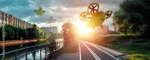 Fotografía Yellow flying taxi against the sky, city electric transport drone