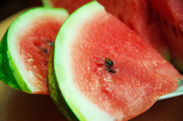 sliced ​​slices of sweet watermelon, background with slices of watermelon