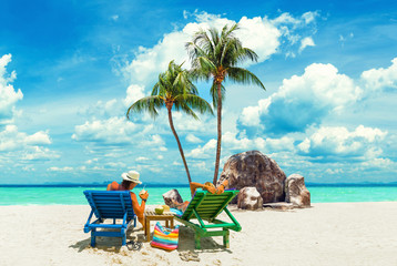 Wall Mural - Couple on the beach at tropical resort Travel