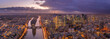 Panoramic aerial drone shot of Neuilly Levallois la defense skyscraper complex financial CBD area with Eiffel tower la seine during sunset hour