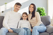 © Studio Romantic - Happy funny family with children smiling sitting on a sofa
