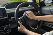 © Lau - Woman hand holding steering horn