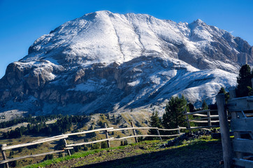 mountain landscape with fence and snow in south tyrol