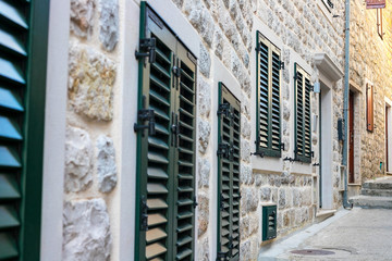 Wall Mural - Winding street of the authentic, old town of Herceg Novi, Montenegro. We see old houses and very narrow