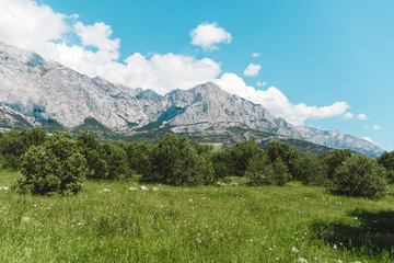 mountains in croatia in daytime with no tourists. peaceful and clean panoramic view in summer