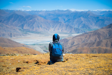 Unidentified person enjoying the natural scene in Tibet