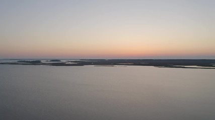 Wall Mural - Flying above a bay and wetlands in North Carolina at dawn 