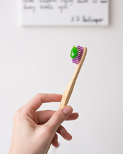 Pink Bamboo Toothbrush With Green Toothpaste